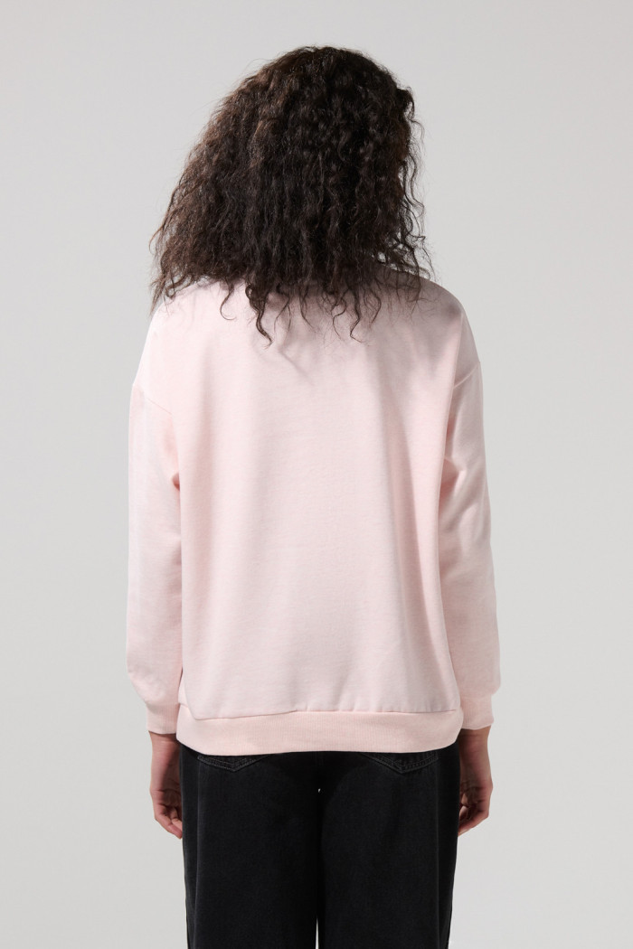 Buzo oversize cuello redondo rosado con arte de My Melody