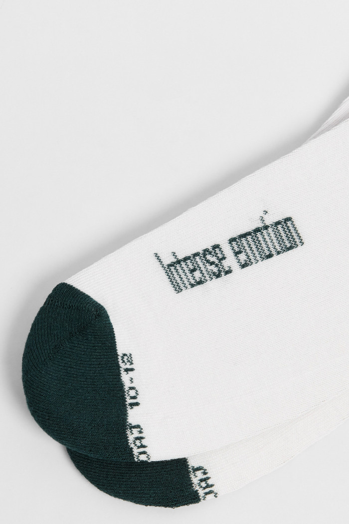 Medias unicolores largas con texto, texturas y elástico