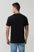 Camiseta unicolor cuello redondo ajustada en algodón