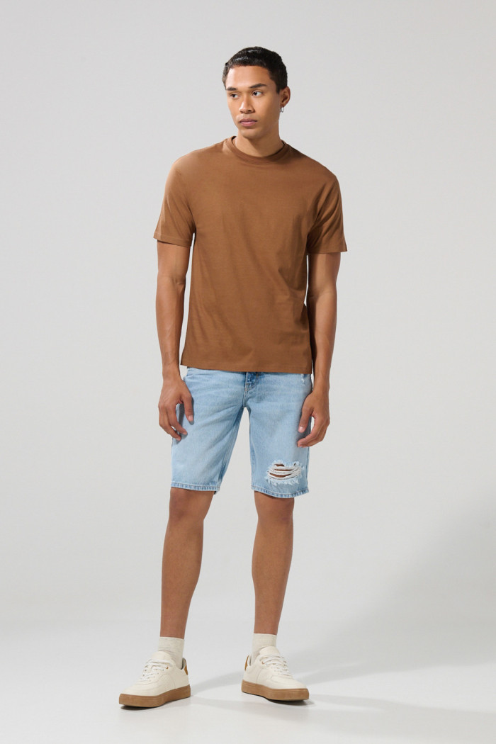 Camiseta unicolor en algodón manga corta con hombro rodado