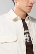 Sobrecamisa con doble bolsillo unicolor y manga larga