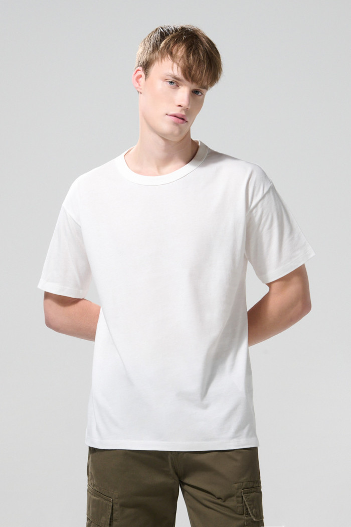Camiseta unicolor manga corta en algodón con hombro rodado