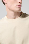 Camiseta manga corta en algodón unicolor con hombro rodado