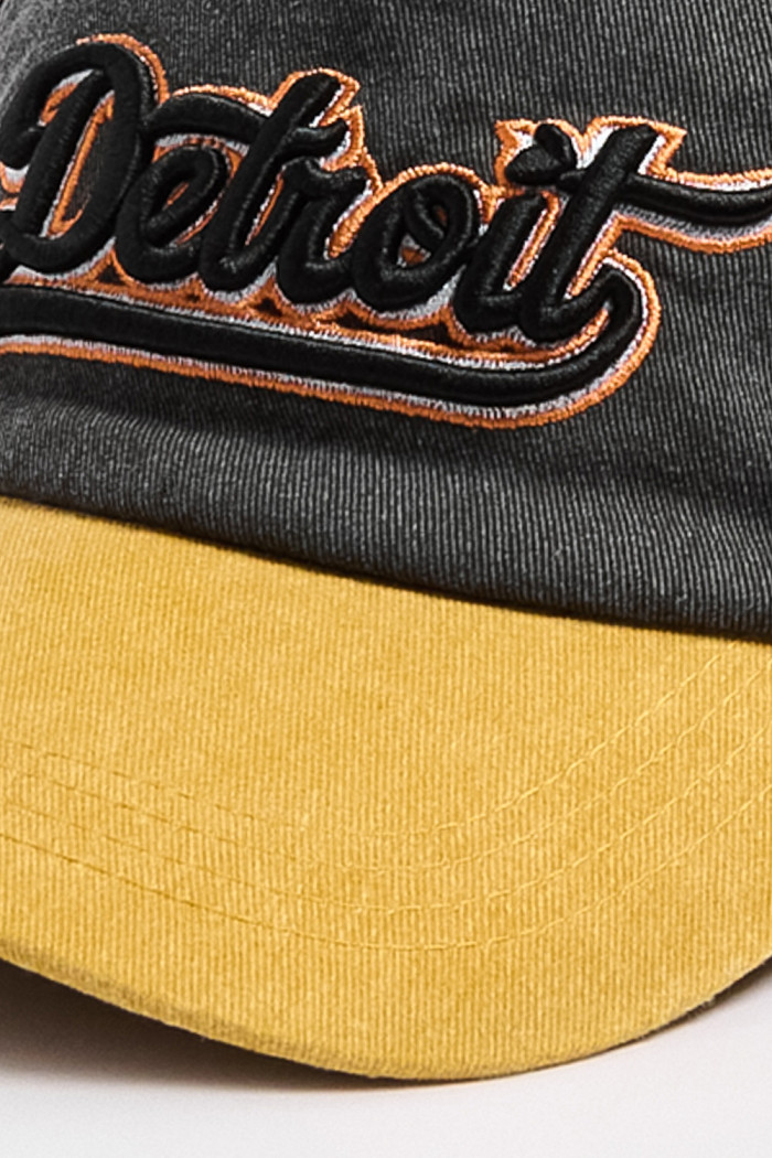 Cachucha negra trucker college con visera amarilla