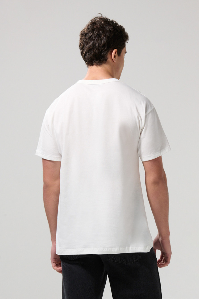 Camiseta manga corta unicolor con hombro rodado en algodón