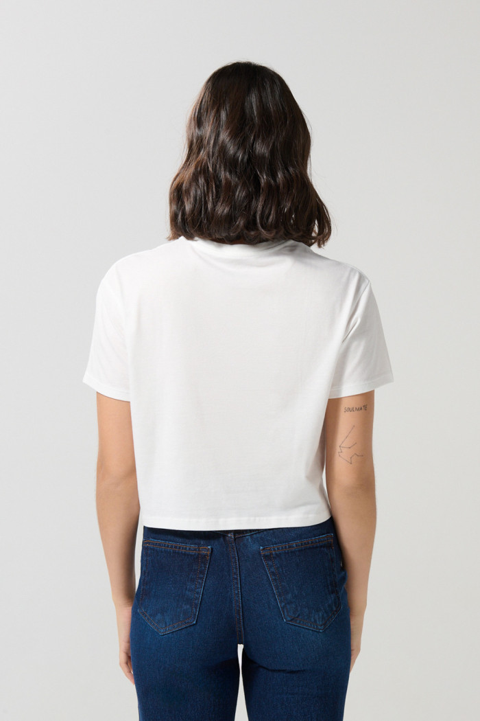 Camiseta crema clara crop top con diseño de Moana
