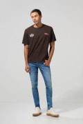 Jean azul medio tipo skinny con bolsillos y tiro bajo