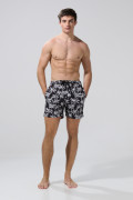 Bermuda playera negra con palmeras blancas y tiro bajo