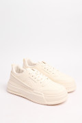 Tenis de plataforma cremas con perforaciones localizadas