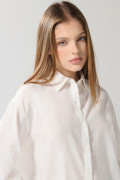 Blusa unicolor oversize manga larga en algodón