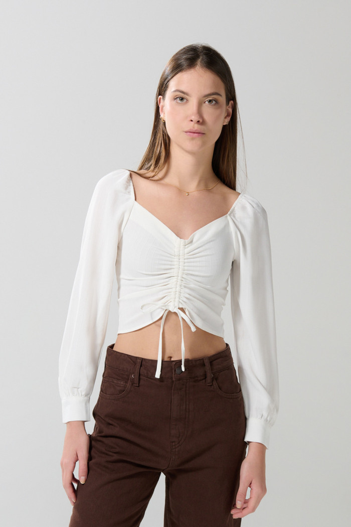 Blusa manga larga unicolor con recogido y escote V