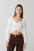 Blusa manga larga unicolor con recogido y escote V