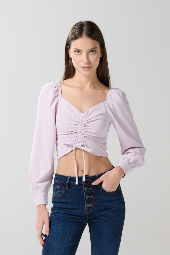 Blusa manga larga unicolor con recogido y escote V