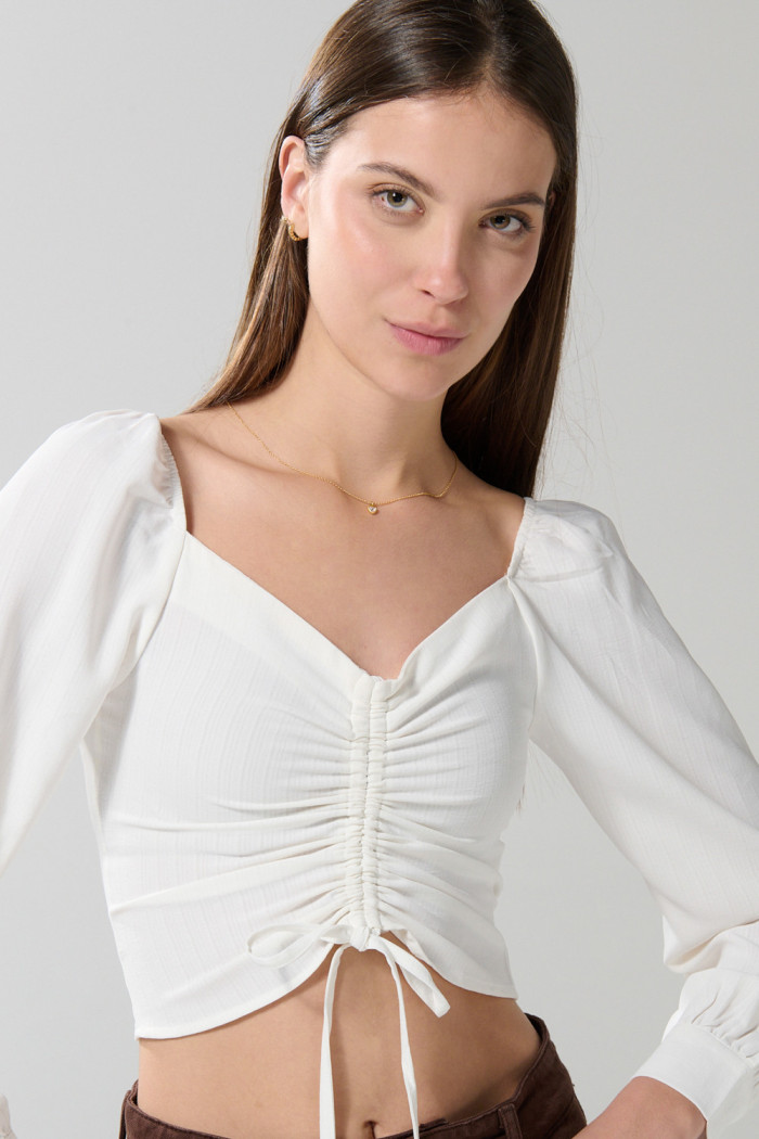 Blusa manga larga unicolor con recogido y escote V