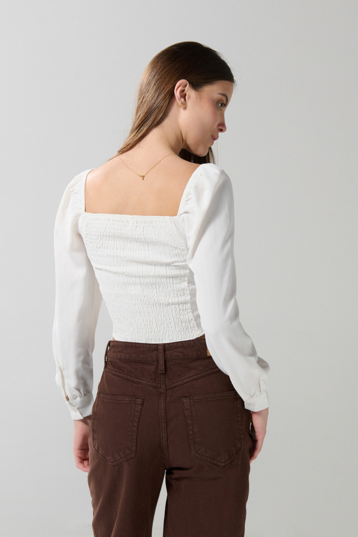 Blusa manga larga unicolor con recogido y escote V
