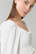 Blusa manga larga unicolor con recogido y escote V