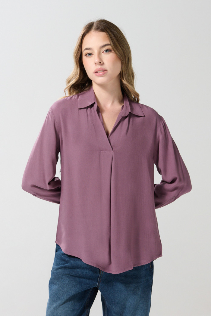 Blusa manga larga unicolor con prense delantero