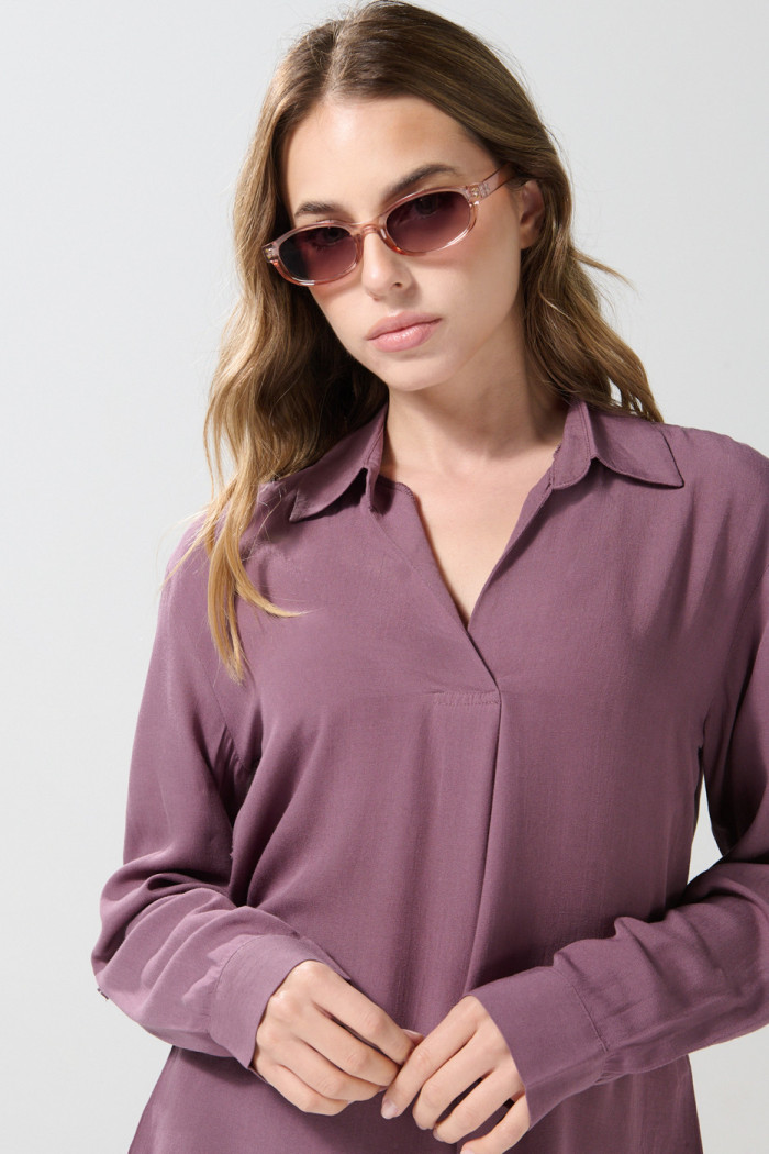 Blusa manga larga unicolor con prense delantero