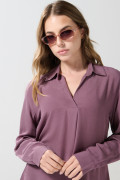 Blusa manga larga unicolor con prense delantero