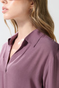 Blusa manga larga unicolor con prense delantero
