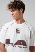 Camiseta oversize crema con arte college y manga ranglan