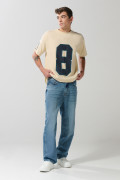 Jean baggy azul medio con bota ancha y 5 bolsillos
