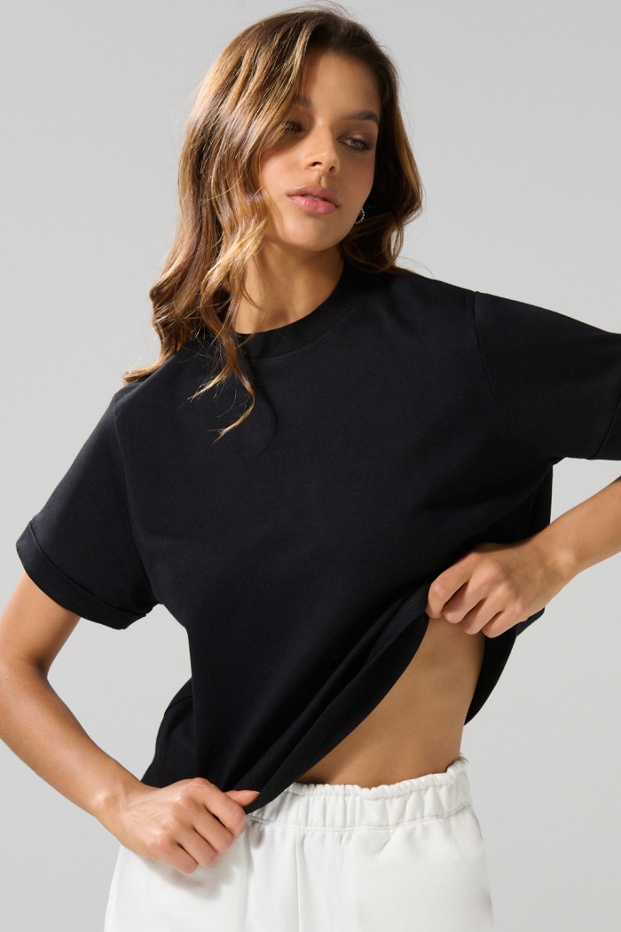 Camiseta crop top unicolor con doblez en puños