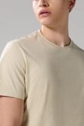 Camiseta cuello redondo unicolor con doblez en puños