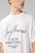 Camiseta oversize crema clara manga corta con texto en frente