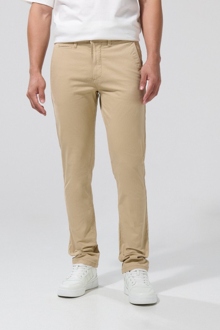 Pantalón slim unicolor de dril con tiro medio y bolsillos