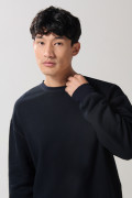Buzo oversize perchado unicolor con cuello redondo
