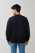 Buzo oversize perchado unicolor con cuello redondo