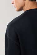 Buzo oversize perchado unicolor con cuello redondo