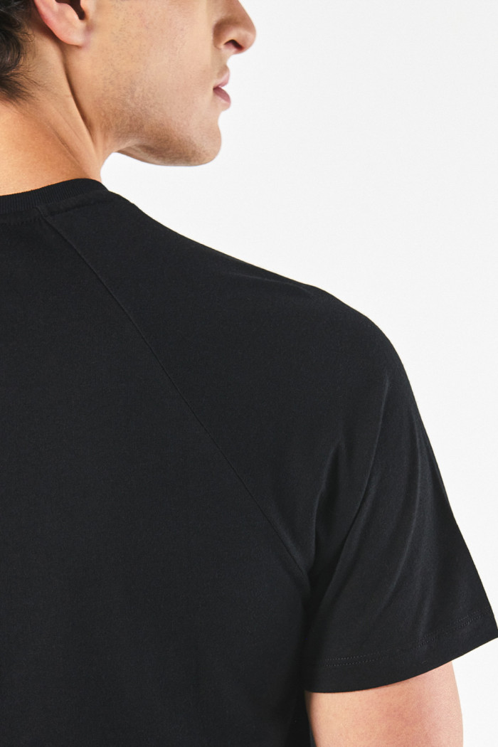 Camiseta manga ranglan corta unicolor en algodón