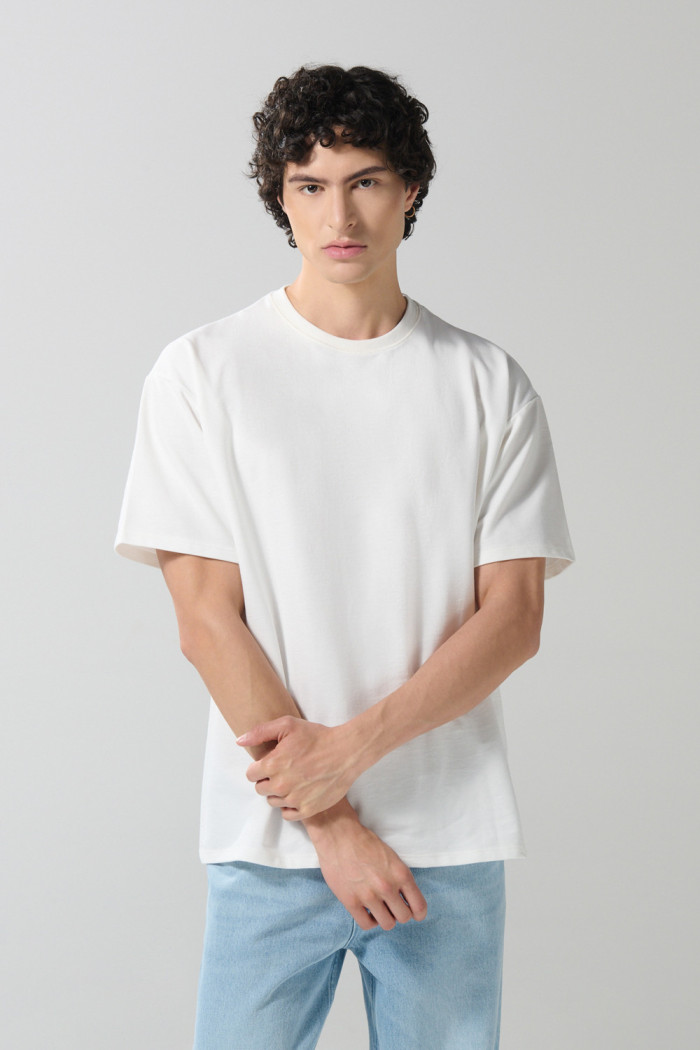 Camiseta unicolor oversize en tela pesada manga corta