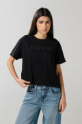 Camiseta unicolor cuello redondo con texto delantero