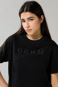 Camiseta unicolor cuello redondo con texto delantero