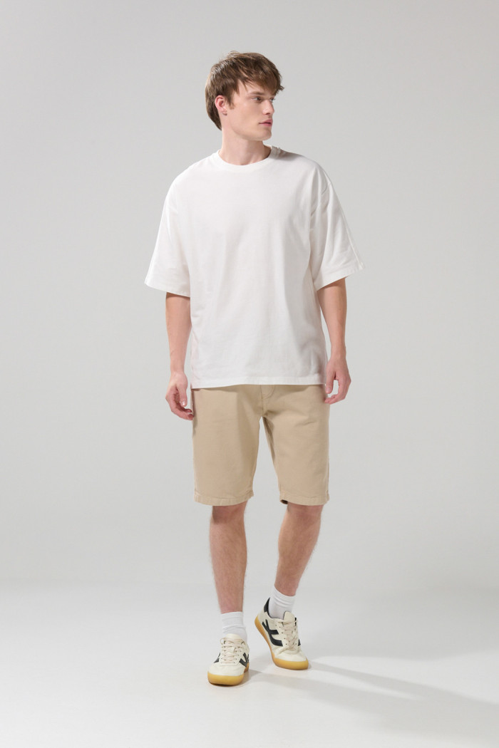 Camiseta unicolor oversize manga corta con textos
