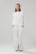 Buzo oversize cuello redondo unicolor con manga ranglan