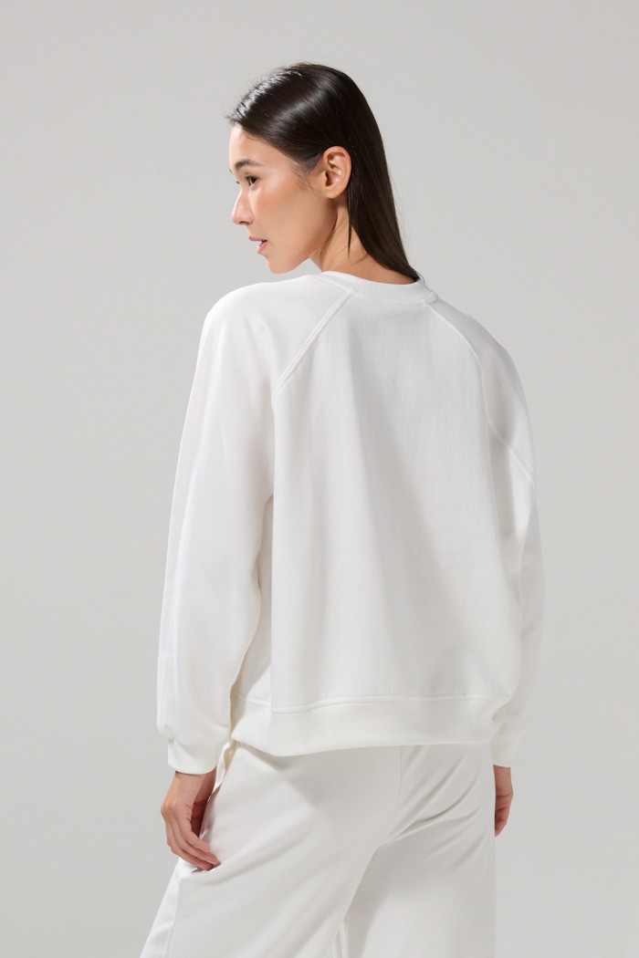 Buzo oversize cuello redondo unicolor con manga ranglan