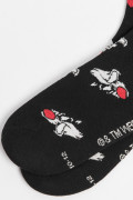 Medias negras tipo cortas con diseños de Looney Tunes
