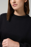 Buzo unicolor crop top cuello redondo con manga larga
