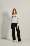 Jean tiro alto 90´S negro con bolsillos y bota recta