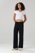 Pantalón flare unicolor en tela acanalada con bota ancha