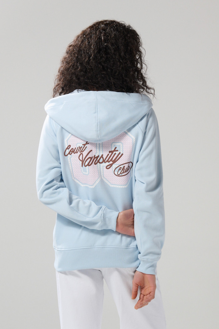 Buzo azul college oversize con cremallera y capota