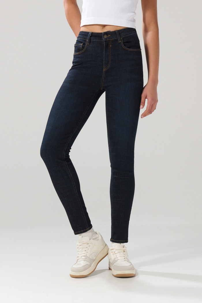 Jean jegging tiro alto azul intenso ceñido con bolsillos