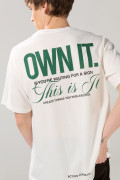 Camiseta unicolor oversize manga corta con textos localizados