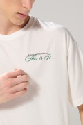 Camiseta unicolor oversize manga corta con textos localizados