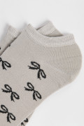 Medias unicolores tobilleras con diseño de moños