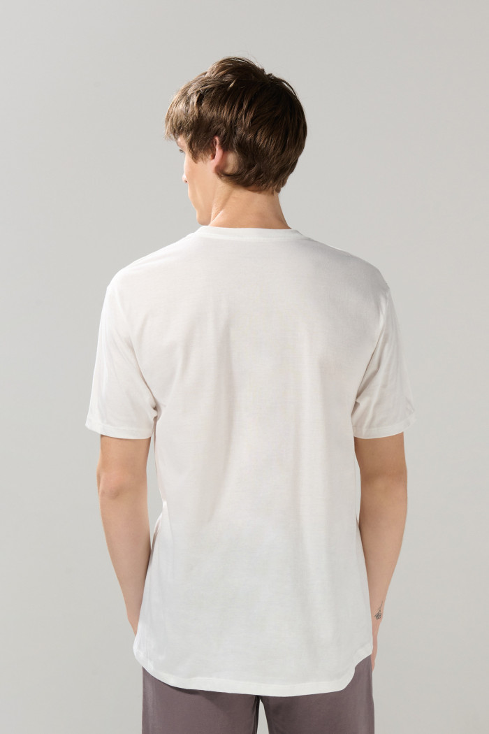 Camiseta unicolor manga corta con hombro rodado en algodón
